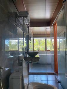 a bathroom with a toilet and a sink at Xuan Son Lakeside Bungalow in Ninh Binh