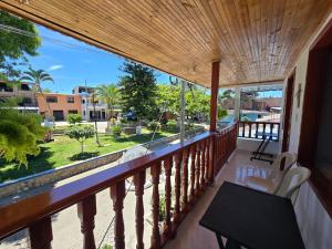 a balcony with a view of the street at Hotel El Balcon de madera in Norcasia