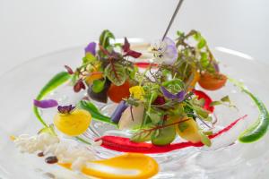 a plate of food with vegetables on it at Hotel Epinard Nasu in Nasu