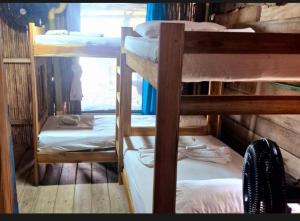 a group of bunk beds in a room at Bob Marley Beach in Guachaca +33 photos