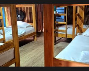 a group of bunk beds in a room at Bob Marley Beach in Guachaca