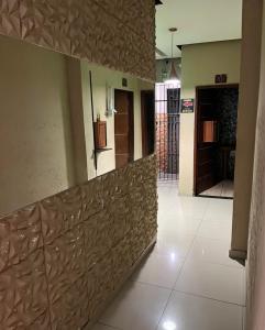 a hallway of a building with a wooden wall at Hotel Santo Amaro inn in São Paulo