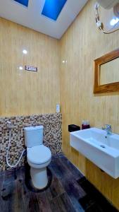 a bathroom with a toilet and a sink at Omah Tabon Homestay Heritage Stay near Malioboro in Yogyakarta +30 photos