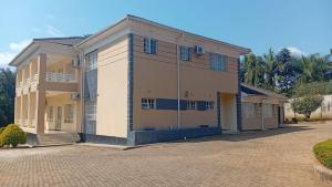 a large house with a driveway in front of it at Royal Homes in Lilongwe