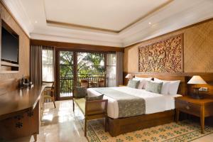 a hotel room with a bed and a balcony at Arkamara Dijiwa Ubud in Ubud +68 photos