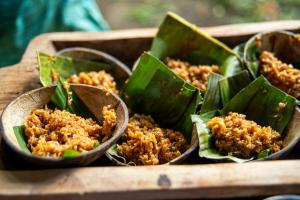 a wooden tray filled with food in wooden bowls at Terrazas del Golfo in La Palma
