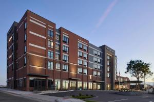 a rendering of a red brick building at SpringHill Suites by Marriott High Point Downtown in High Point