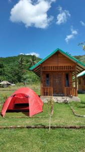 a red tent in front of a house at Beach Camp Lombok in Sekotong +28 photos