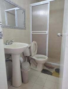 a bathroom with a sink and a toilet and a shower at Villa Hercilia - Rodadero in Rodadero +20 photos