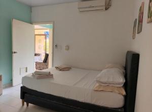 a bedroom with a large bed in a room at Villa Hercilia - Rodadero in Rodadero