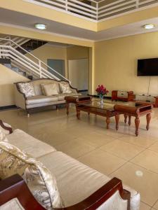 a living room with a couch and a coffee table at Royal Homes in Lilongwe
