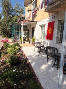 a flag is hanging on the side of a building at Hostel 1869 in Karakol