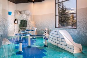 a childs room with a pool of water at Meliá Sierra Nevada in Sierra Nevada