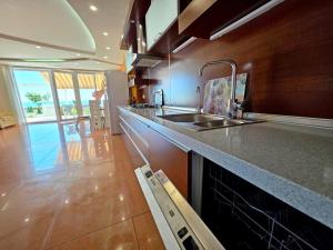 a kitchen with a sink and a counter top at Приватний Пляж та Релакс у моря без сторонніх in Odesa +127 photos