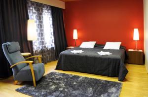 Postel nebo postele na pokoji v ubytování Finlandia Hotel Lumiainen + 6 fotografií