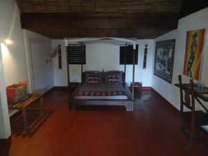 a room with a bed in the middle of a room at Boraha Village Ecolodge in Ambodifototra