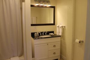 a bathroom with a sink and a mirror at The Inn on the Wharf in Lubec