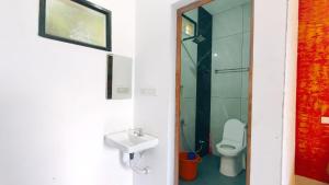 a bathroom with a toilet and a sink at Vagamon leafhill mountain view holidays in Vagamon