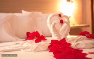 Ένα ή περισσότερα κρεβάτια σε δωμάτιο στο Hotel Cesaria