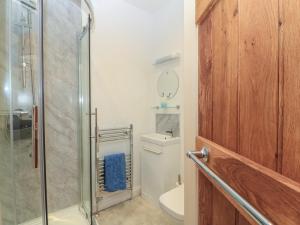 a bathroom with a toilet and a glass shower at Dale Barton in Wells +19 photos