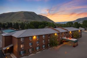 an aerial view of a hotel with mountains in the background at Super 8 by Wyndham Jackson Hole in Jackson