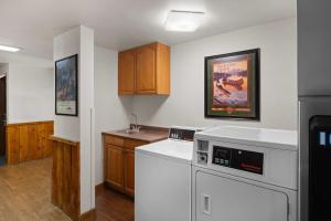 a kitchen with a washer and dryer in it at Super 8 by Wyndham Jackson Hole in Jackson