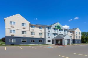 a rendering of a hotel with a parking lot at Wingate by Wyndham Oshkosh in Oshkosh