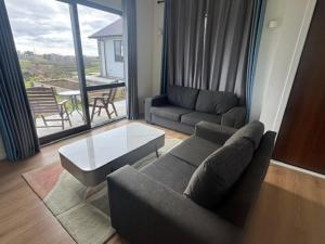 a living room with a couch and a coffee table at 2 Bedroom Granny Flat in Runciman