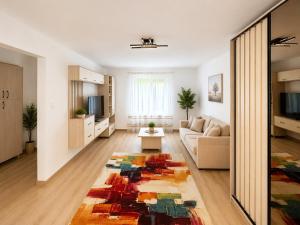 a living room with a couch and a rug at Vila Ioana in Ştefăneşti