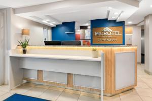 a lobby with a reception counter with a morocco sign at Microtel Inn & Suites - Greenville in Greenville