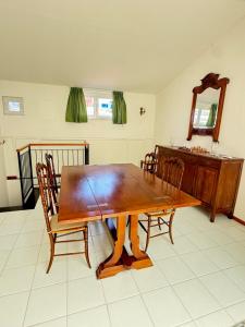 a dining room table with chairs and a sink at Happy Haven al mare in Riviera in Chiavari +10 photos