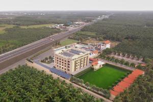 an overhead view of a large building with a green yard at Enrise By Sayaji Somnath in Somnath