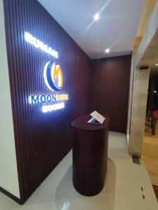 a sign for a korean music company in a room at Moonrise Rooms in Uluwatu