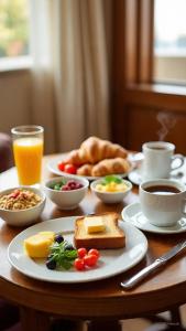 a table with a plate of breakfast food on it at Hotel Prithvi Studio - RDC And Santosh Hospital in Ghaziabad