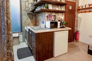 a kitchen with a sink and a counter top at Студио Мурите in Sapareva Banya