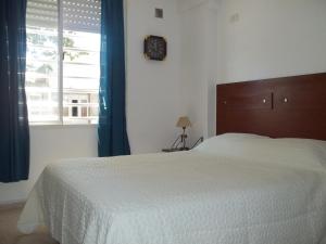 Una cama o camas en una habitación de Apartamento Pichincha Rosario