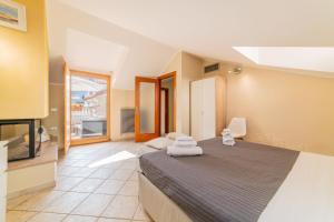 a bedroom with a large bed and a television at B&B Portanova in Salerno