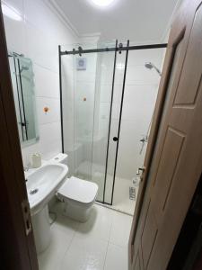 a bathroom with a shower and a toilet and a sink at nader s in Hajreien