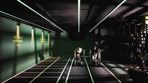 two people sitting on chairs in a dark room at Sporthotel Zoll in Vipiteno +59 photos