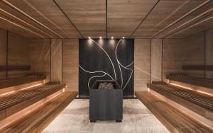 a bowling alley with a black wall at Sporthotel Zoll in Vipiteno