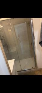 a shower with a glass door in a bathroom at Appartement Ipanema Sud in Canet-en-Roussillon