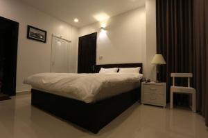 Postel nebo postele na pokoji v ubytování Xuan Cuong Hotel