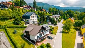 an aerial view of a village with a house at Pension Kubát in Špindlerův Mlýn
