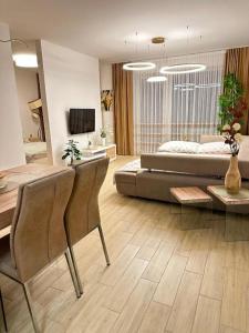 a large living room with a bed and a couch at Golf Green Resort - Hesperus 2 in Hrubá Borša