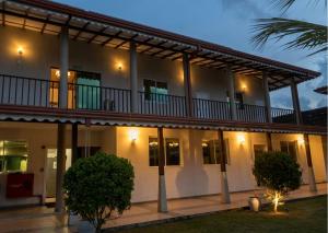 an exterior view of a building at night at Nilakma Lagoon in Negombo