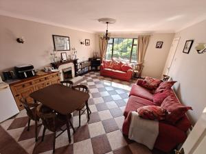 a living room with a couch and a table at Riverview House in Athlone