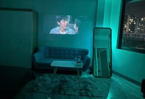 a living room with a couch and a table at Mayhome in Long Biên
