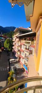 a view from a balcony of a building at Tilanjali Stay in Soreng