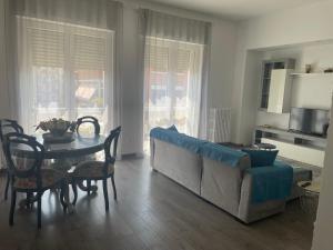 a living room with a couch and a table at Casa Biancola, Novara Centro in Novara