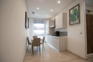 a kitchen and dining room with a table and chairs at B&B Cannito in Altamura +20 photos